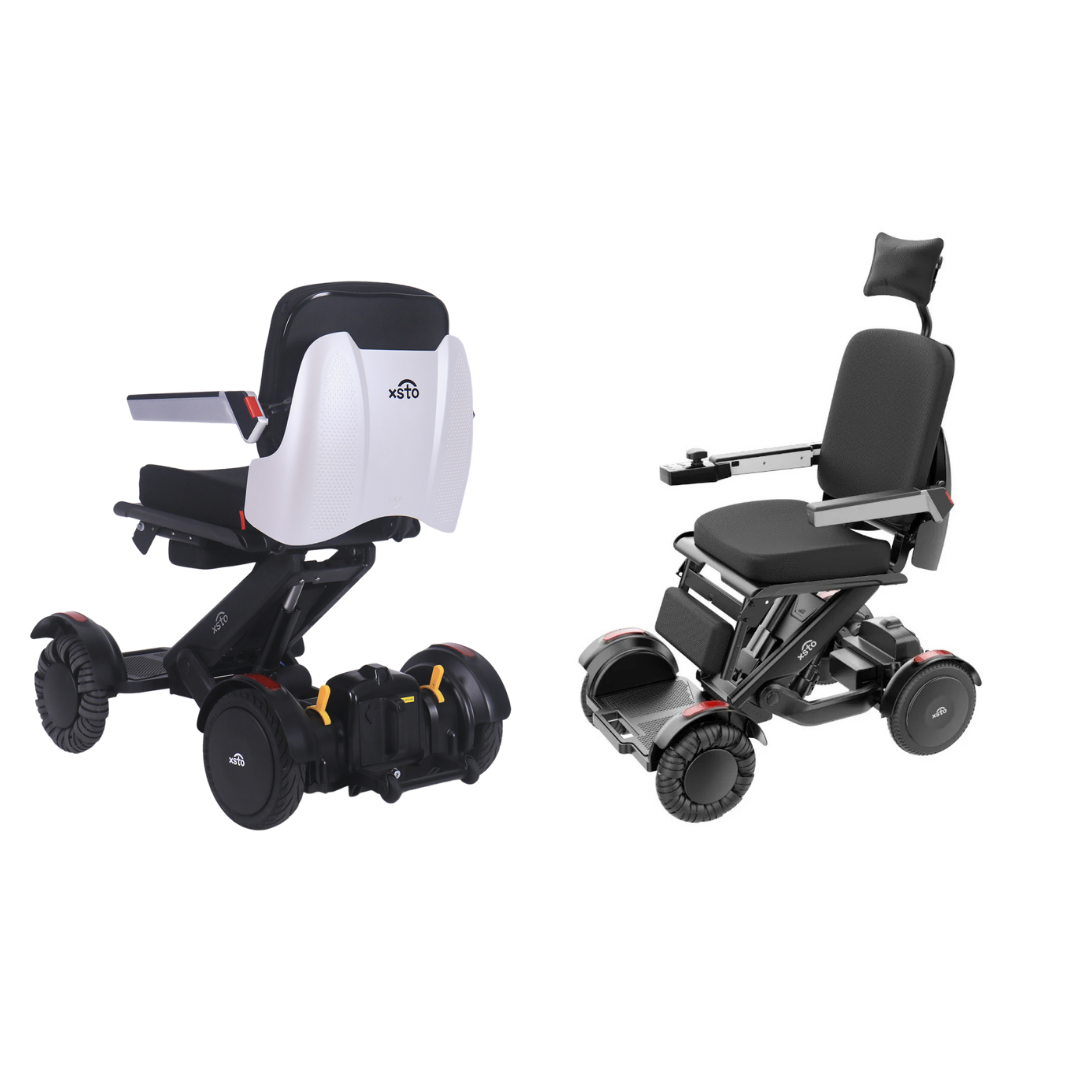 Two XSTO Mobility M4 Self-Balancing Powerchairs with black seats and large wheels are side by side. The left chair is shown from the back with a white backrest; the right, viewed from the front, has a headrest and armrests.